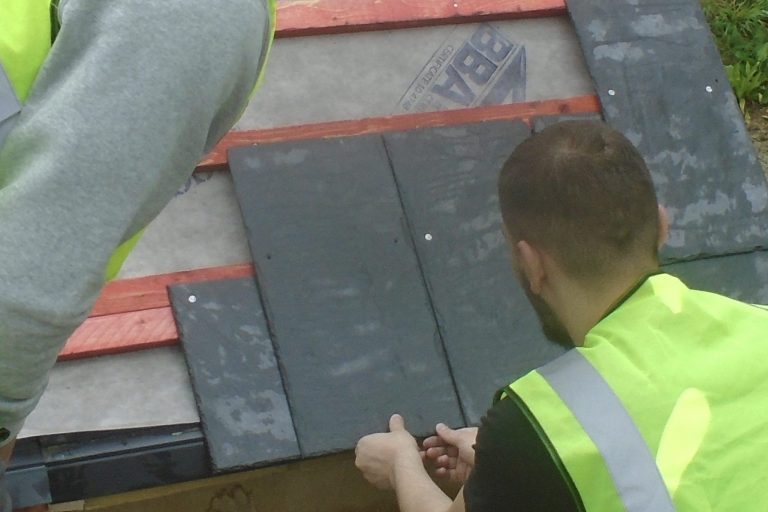 Person fitting pitched roof